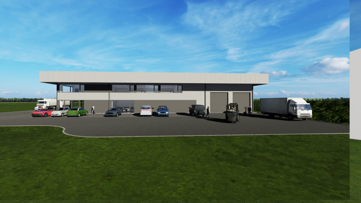 neubau moderne gewerbehalle industriehalle hechingen – ansicht süd mit parkplatz und anlieferung moderne industriehalle mit großer einfahrt und grauer fassade